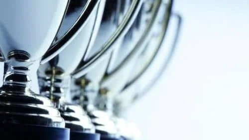 Close-up of silver trophies for small business awards.