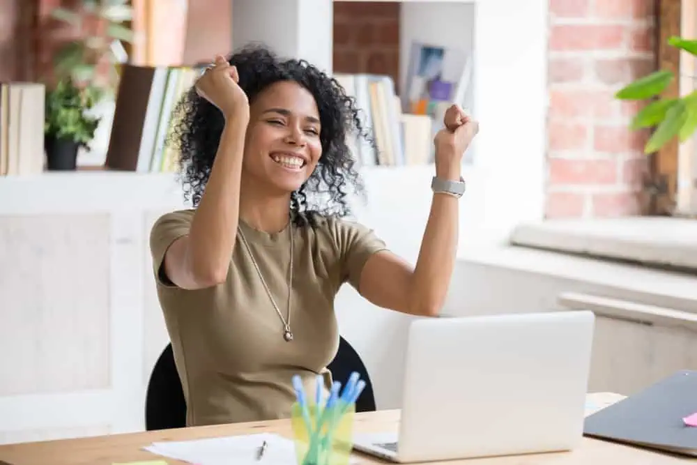 Small business owner celebrating loan approval.