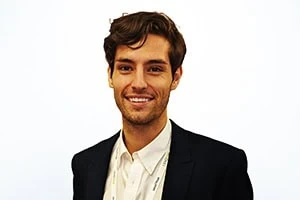 Business professional smiling, representing staffing company financing options.