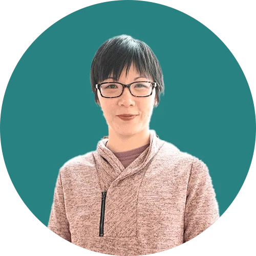 Woman smiling with glasses representing Credibly financial services.