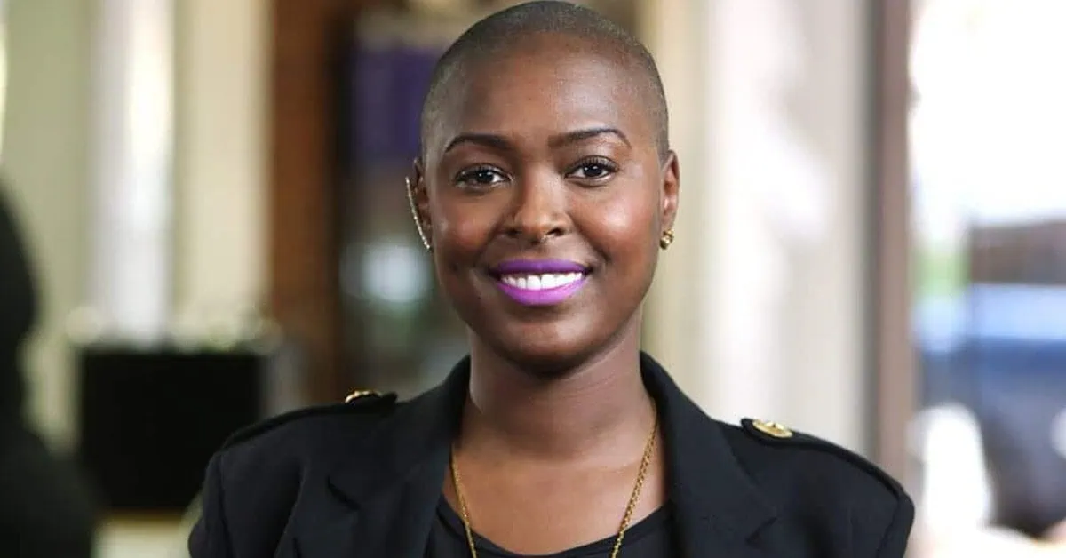 Professional woman smiling, representing business financing services.