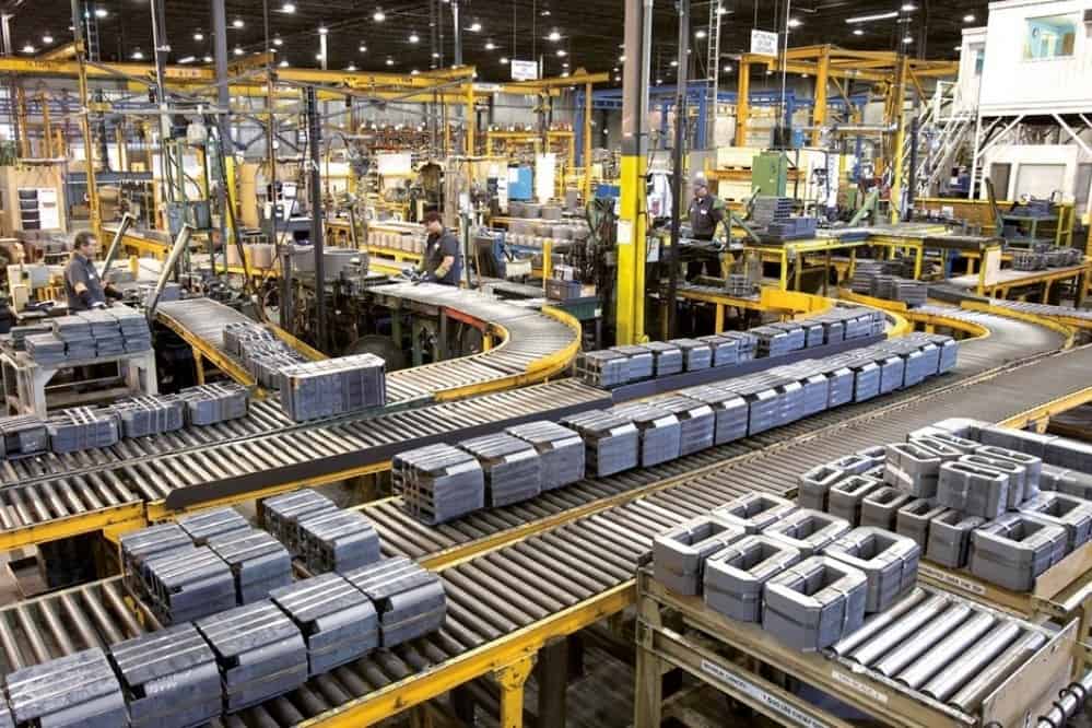 Manufacturing facility with conveyor belts and machinery for production processes.
